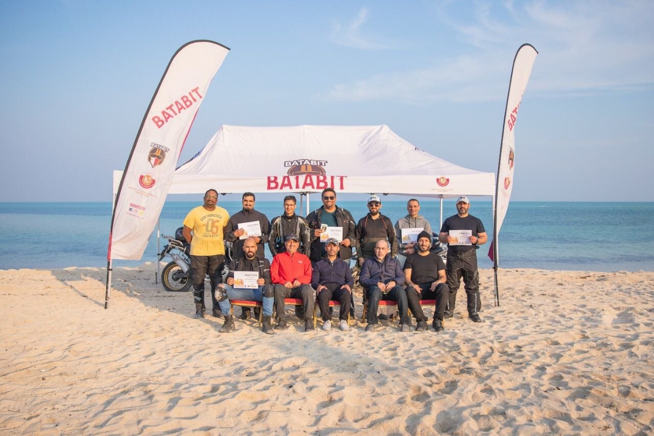 Custom beach event tent and printed flags for an outdoor sports event