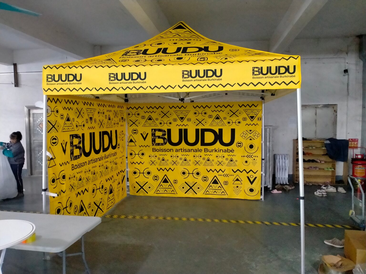 Custom printed pop-up event tent with two full side walls for a beverage brand